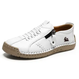 Mocasines de cuero blanco cosidos a mano con cremallera lateral y suela de goma duradera