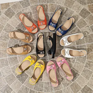 Women's open-toe flat sandals with rhinestone bow decoration in various vibrant colors