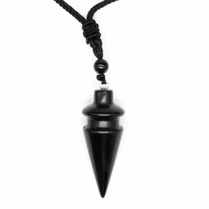 Detailed view of a polished black cone crystal pendant with a black cord necklace.