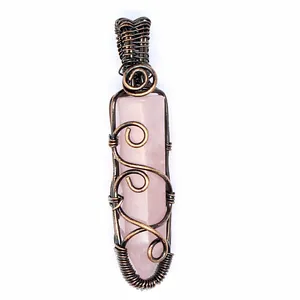 Detailed view of handmade wire wrapped rose quartz hexagonal crystal point pendant