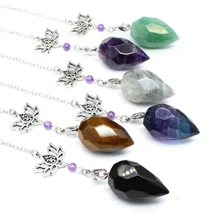 Selection of faceted natural stone crystal pendulums featuring silver lotus flower charms