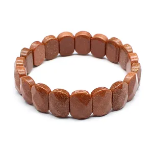 Detailed shot of brown goldstone faceted stretch bracelet with shimmering gold specks
