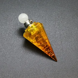Detail view of a hexagonal conical resin pendant with yellow tourmaline chips inside.