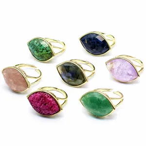 Adjustable Eye of Horus rings set with natural labradorite and quartz gemstones