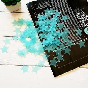 Detail view of multiple light blue 3D glow-in-the-dark star stickers for wall decoration