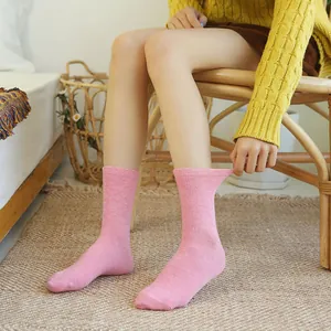 Comfortable candy colored pink mid-calf cotton socks for women displayed on model