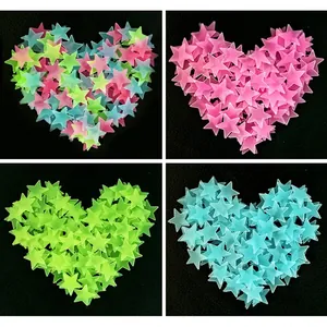 Detailed view of 3D glow-in-the-dark plastic star wall stickers in four vibrant color options