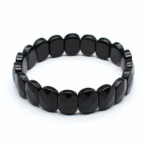 Detailed view of a faceted black natural stone bracelet featuring oval beads for women