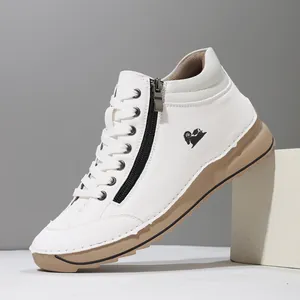 Detail view of white high-top women's casual shoes with side zipper and hand-stitched details.