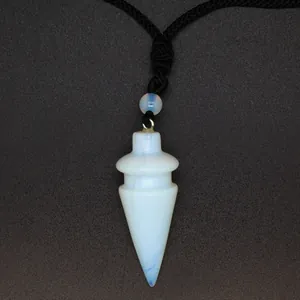 Close-up of a conical opalite crystal pendant with black braided cord necklace