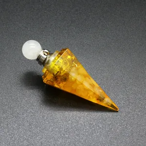 Macro view of hexagonal resin perfume bottle filled with yellow tourmaline gravel