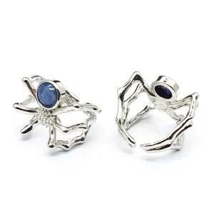 Macro view of the spider open ring featuring a blue kyanite stone and silver-tone finish