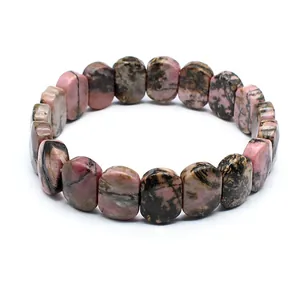 Detailed view of natural rhodonite stone bracelet with unique pink and black patterns