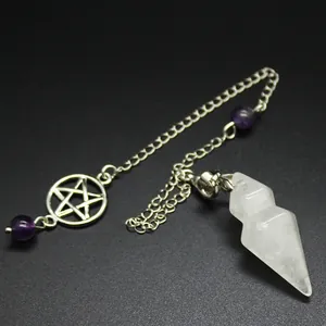 Detailed shot of a hexagonal crystal pendulum with pentagram charm and amethyst beads.