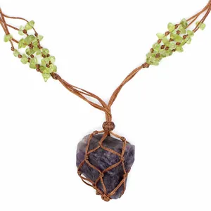 Handmade woven net necklace with raw purple fluorite pendant and peridot stone chips