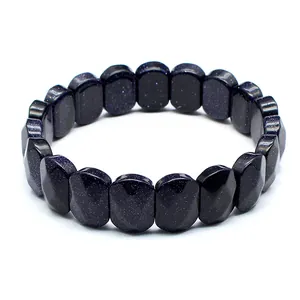 Macro detail view of faceted blue sandstone beads with shimmering starry night texture