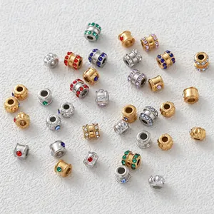 Detailed view of stainless steel spacer beads with colorful cubic zirconia inlays