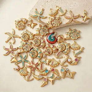 Diverse collection of gold-plated stainless steel marine pendants featuring colorful zircon
