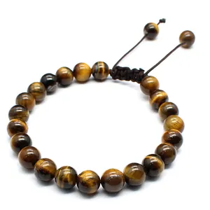 Macro view showing the natural silk luster of 8mm tiger eye beads on the bracelet