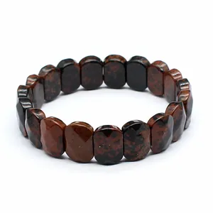 Detailed macro view of faceted mahogany obsidian natural stone beads on an elastic bracelet