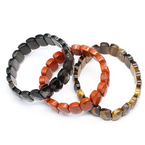 Detailed macro view of faceted natural Tiger's Eye and Red Jasper beaded stone bracelets