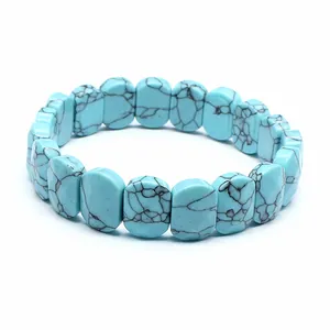 Detailed view of rectangle blue turquoise matrix stone beads on a stretch bracelet
