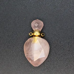 Detailed macro shot of a faceted rose quartz essential oil bottle pendant with gold bail.