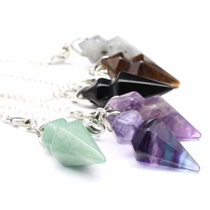 Macro detail of natural stone hexagonal cone pendulum pendants in various colors