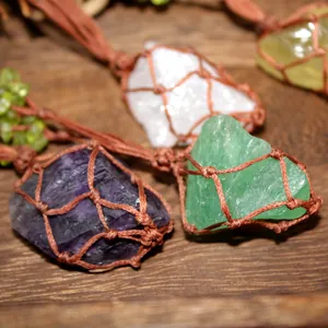 Detailed macro view of raw natural crystals inside handcrafted brown woven net pouches