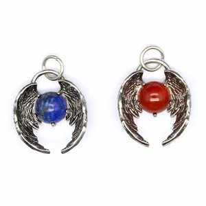 Detailed view of angel wing pendants featuring blue lapis and red carnelian beads
