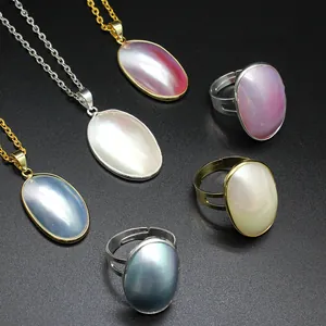 Handmade sea Mabe pearl pendant and ring set with colorful iridescent shell stones