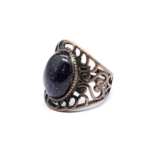 Macro detail of a medieval style hollow ring with a sparkling blue sandstone gem