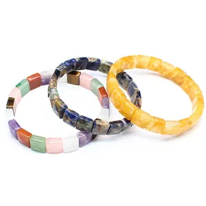 Detailed view of three square cut natural stone crystal bracelets in various vibrant colors
