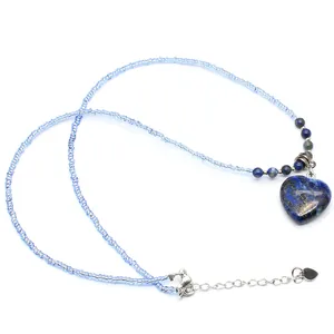 Blue beaded necklace with heart-shaped stone pendant and adjustable metal clasp.