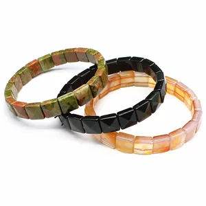 Detail view showing three natural stone faceted square bead bracelets in various colors