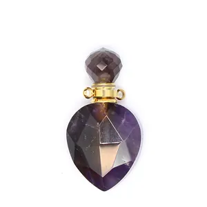 Macro view of faceted purple amethyst crystal perfume bottle pendant with golden hardware