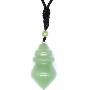 Macro view of a faceted green aventurine cone-shaped pendant with black braided cord