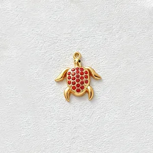 Elegant gold-plated stainless steel sea turtle pendant with vibrant red zircon inlay detail