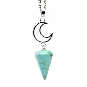 Detailed macro view of the silver moon pendant and textured turquoise hexagonal stone