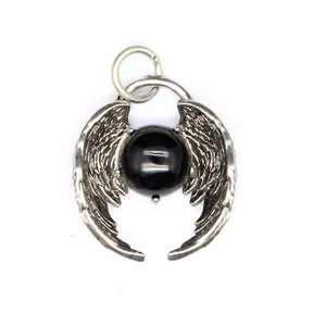 Detailed view of vintage silver angel wings pendant with a polished black crystal bead.