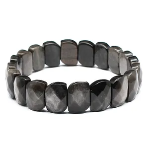 Macro detail of faceted dark sheen obsidian rectangular bead hand row bracelet