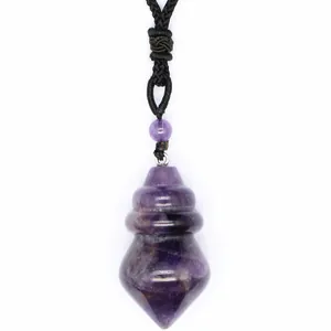 Detail showing the natural texture of a conical amethyst crystal pendant with cord