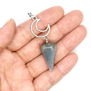 Detailed macro view of a natural labradorite hexagonal cone moon pendant on a hand