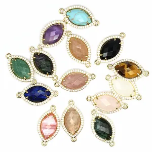 Vista dettagliata di vari connettori marquise in pietra naturale con bordi micro-pavé lucidi