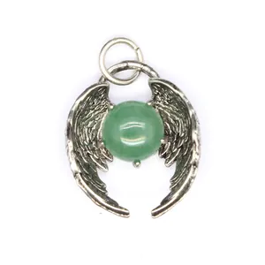 Close-up view of a silver angel wing pendant featuring a round green crystal bead