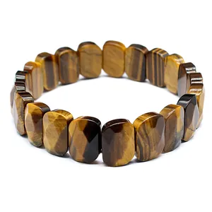 Macro view of faceted natural tiger's eye stone beads on a stretch elastic bracelet.