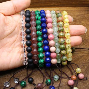 Detailed view of various 8mm natural stone beads on handmade woven adjustable bracelets.