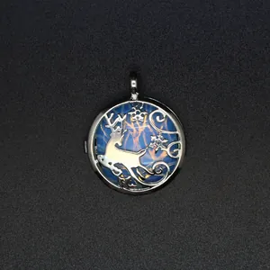 Detailed view of a silver reindeer locket pendant with a blue marbled crystal stone.