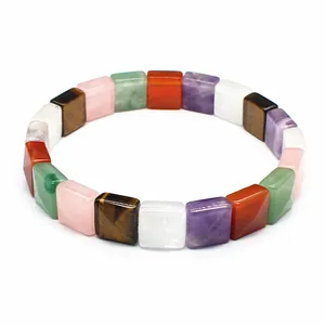 Close-up of faceted square natural stone beads in a colorful stretch bracelet