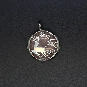 Macro detail showing the intricate silver reindeer carving over rose quartz stone